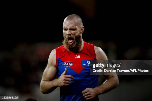Max Gawn of the Demons reacts after receiving a knock to his face in a marking contest during the round 15 AFL match between the Essendon Bombers and...