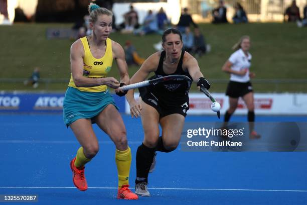Stephanie Kershaw of the Hockeyroos and Stephanie Dickins of the Black Sticks contest for the ball during the FIH Pro League match between the...