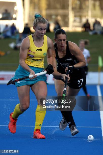Stephanie Kershaw of the Hockeyroos and Stephanie Dickins of the Black Sticks contest for the ball during the FIH Pro League match between the...