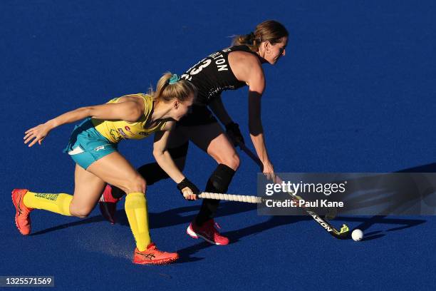 Samantha Charlton of the Black Sticks is challenged by Stephanie Kershaw of the Hockeyroos during the FIH Pro League match between the Australian...