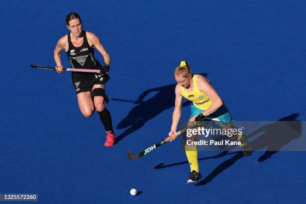 Amy Lawton of the Hockeyroos controls the ball against Samantha Charlton of the Black Sticks during the FIH Pro League match between the Australian...