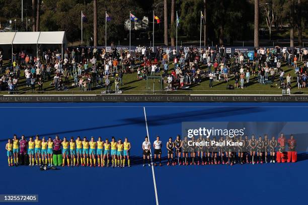 Teams line up for the national anthems during the FIH Pro League match between the Australian Hockeyroos and the New Zealand Black Sticks at Perth...