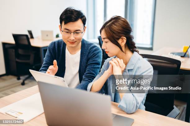 confident asian businesswoman discussing with colleagues. - design studio woman chinese laptop bildbanksfoton och bilder