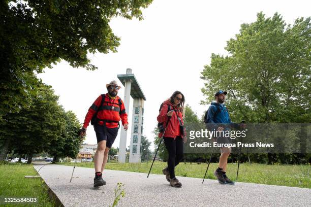 Three people without masks, arrive in the city of Santiago de Compostela, after having walked the Camino de Santiago, during the first day in which...
