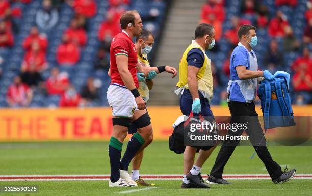 Alun Wyn Jones of the Lions is helped off the field with an arm injury during the 1888 Cup match between the British & Irish Lions and Japan at BT...