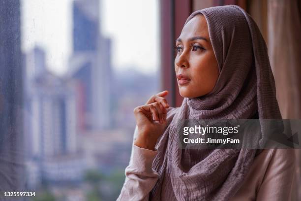 portrait of a malay muslim woman - southeast stock pictures, royalty-free photos & images