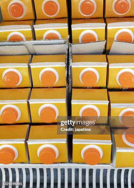 orange juice bricks - juice box stock pictures, royalty-free photos & images
