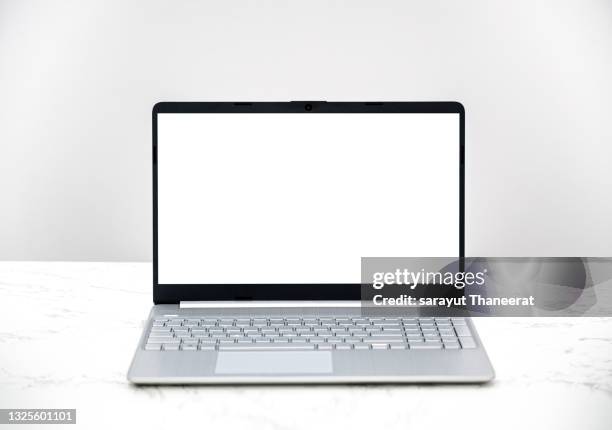 computer white screen notebook sits on a white desk white background - open laptop stock pictures, royalty-free photos & images