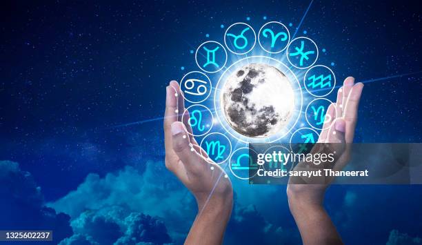 zodiac signs inside of horoscope circle. astrology in the sky with many stars and moons  astrology and horoscopes concept - astrology stock pictures, royalty-free photos & images