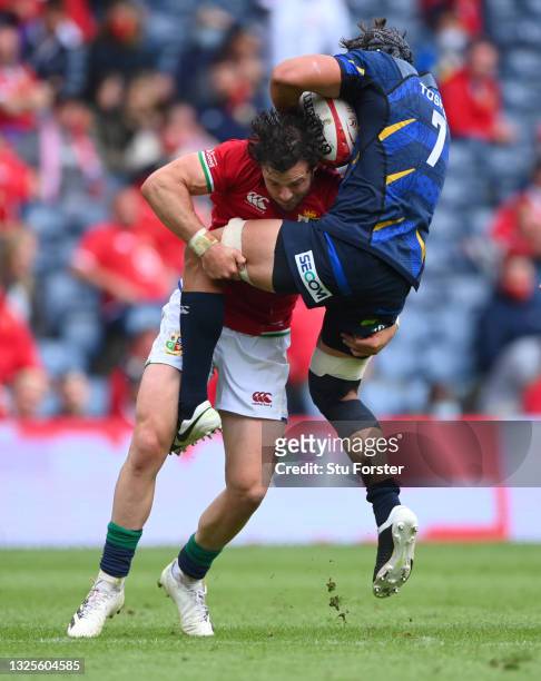 Lions player Robbie Henshaw puts in a tackle on Japan player Pieter Labuschagne during the 1888 Cup match between the British & Irish Lions and Japan...