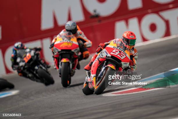 Marc Marquez of Spain and Repsol Honda Team rides in front of Pol Espargaro of Spain and Repsol Honda Team during the MotoGP qualifying session at TT...