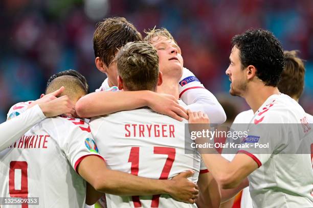 Kasper Dolberg of Denmark celebrates with team mates after scoring their side's second goal during the UEFA Euro 2020 Championship Round of 16 match...