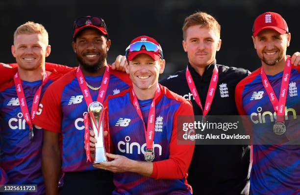 Eoin Morgan of England lifts the Vitality IT20 Series Trophy with teammates after the T20 International Series Third T20I match between England and...