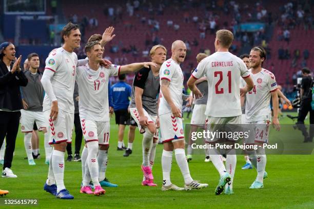 Nicolai Boilesen of Denmark celebrates with Jannik Vestergaard, Jens Stryger Larsen and teammates after victory in the UEFA Euro 2020 Championship...