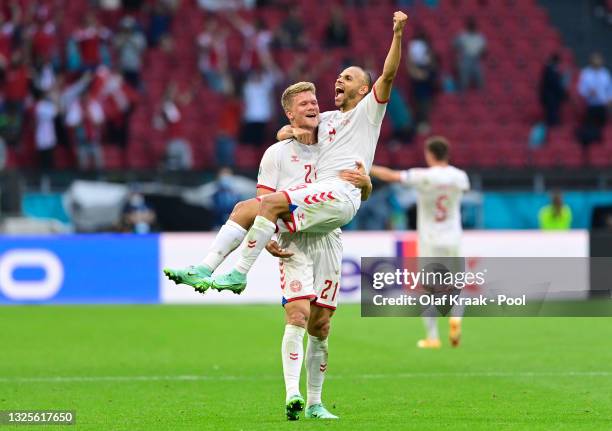 Andreas Cornelius and Martin Braithwaite of Denmark celebrate their side's victory after the UEFA Euro 2020 Championship Round of 16 match between...