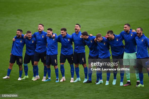 Players of Italy stand for the national anthem prior to the UEFA Euro 2020 Championship Round of 16 match between Italy and Austria at Wembley...