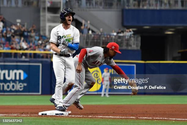 Brett Phillips of the Tampa Bay Rays reacts after hitting a two run triple during the fourth inning against the Los Angeles Angels at Tropicana Field...