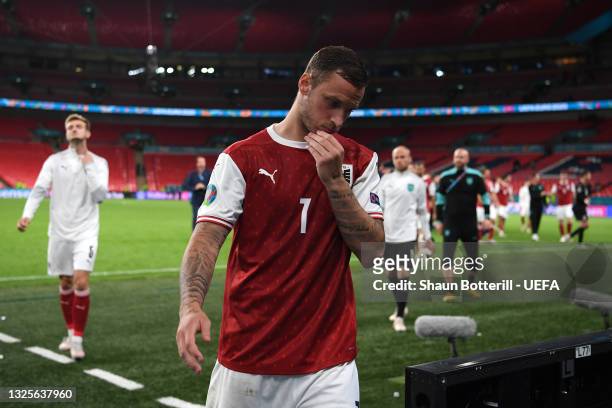 Marko Arnautovic of Austria looks dejected as he leaves the pitch following defeat in the UEFA Euro 2020 Championship Round of 16 match between Italy...