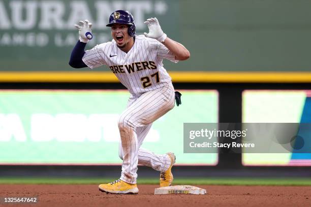 Willy Adames of the Milwaukee Brewers reacts to a double during the eighth inning against the Colorado Rockies at American Family Field on June 26,...