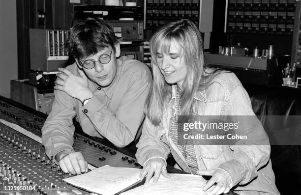 American singer-songwriter, Melissa Etheridge, with English record producer and engineer, Hugh Padgham, in a Los Angeles recording studio, circa...