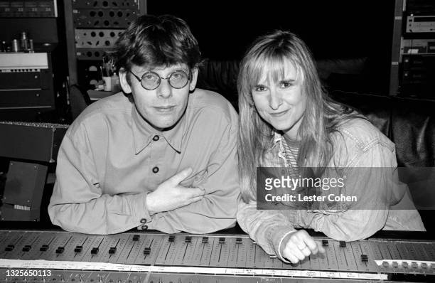 American singer-songwriter, Melissa Etheridge, with English record producer and engineer, Hugh Padgham, in a Los Angeles recording studio, circa...