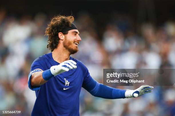 Cody Bellinger of the Los Angeles Dodgers celebrates his walk-off home run against the Chicago Cubs in the ninth inning at Dodger Stadium on June 26,...