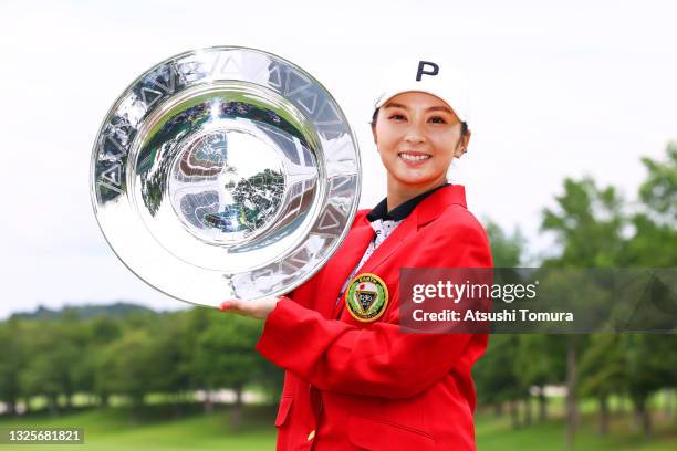 Erika Kikuchi of Japan poses with the trophy after winning the tournament following the final round of the Earth Mondamin Cup at Camellia Hills...