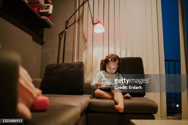 the girl draw and create her imagination during waiting for her father - stock photo - alpha female stock pictures, royalty-free photos & images