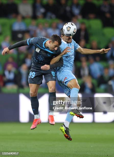 Adam Le Fondre of Sydney FC and Nuno Reis of Melbourne City compete to head the ball during the A-League Grand Final match between Melbourne City and...