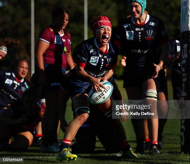 Melanie Kawa of the Rebels celebrates scoring a try during the round two Super W match between the Melbourne Rebels and the Queensland Reds at Coffs...