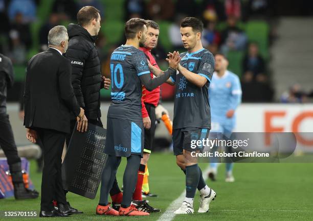 Alex Baumjohann of Sydney FC is seen being substituted for Milos Ninkovic of Sydney FC during the A-League Grand Final match between Melbourne City...