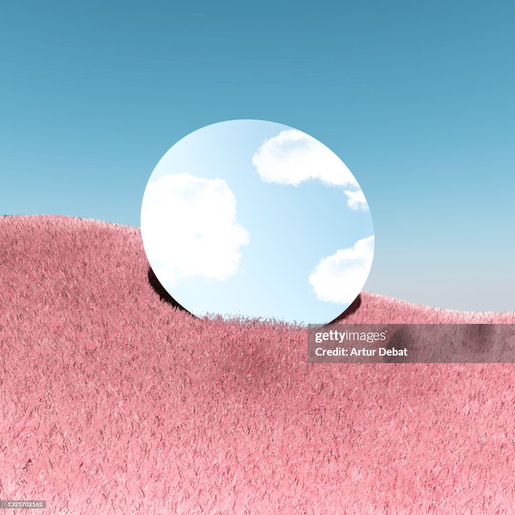 Poetic picture of mirror reflecting blue sky in digital surreal landscape with pink grass.