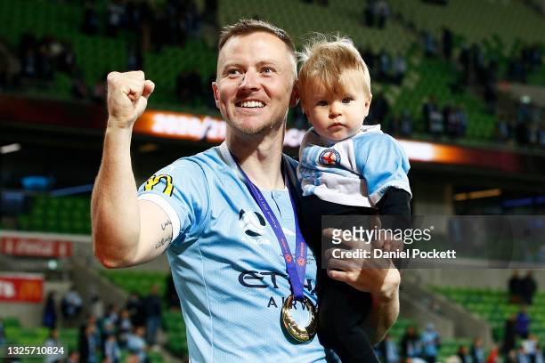 Scott Jamieson of Melbourne City celebrates with his son after winning the A-League Grand Final match between Melbourne City and Sydney FC at AAMI...