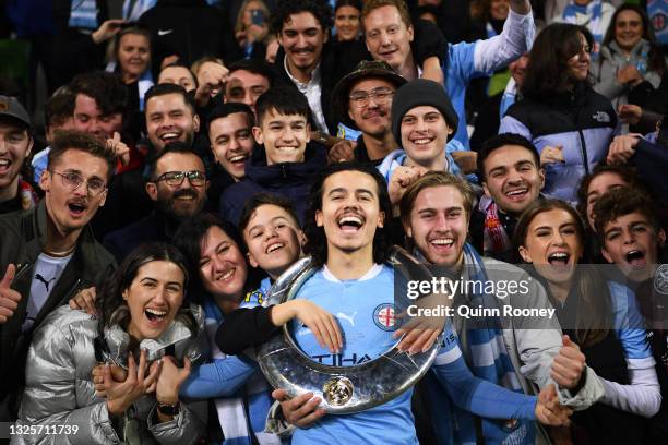 Stefan Colakovski of Melbourne City celebrates victory with fans and holds aloft the A-League trophy during the A-League Grand Final match between...