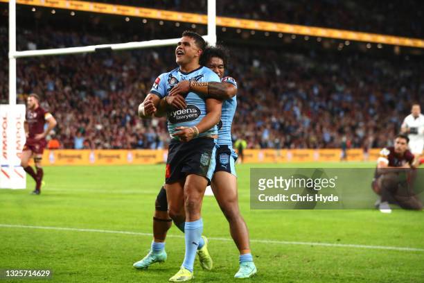 Latrell Mitchell of the Blues celebrates after scoring a try with Brian To'o of the Blues during game two of the 2021 State of Origin series between...