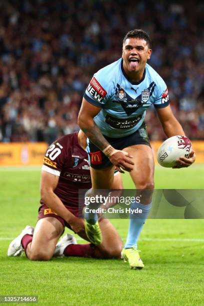 Latrell Mitchell of the Blues celebrates after scoring a try during game two of the 2021 State of Origin series between the Queensland Maroons and...