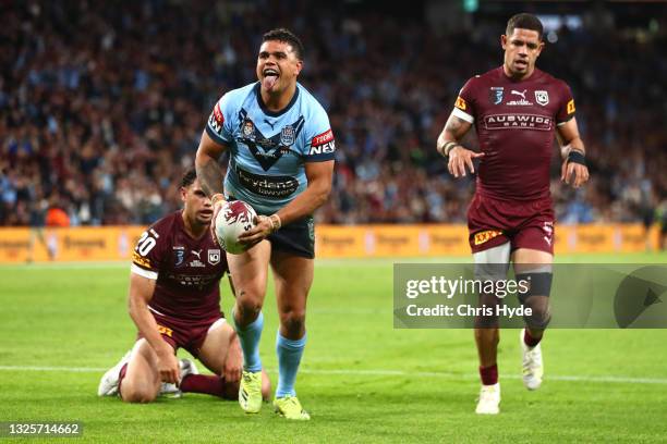 Latrell Mitchell of the Blues celebrates after scoring a try during game two of the 2021 State of Origin series between the Queensland Maroons and...