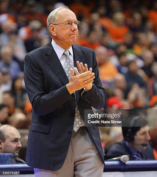 Head coach of the Syracuse Orange, Jim Boeheim claps during play against the Fordham University Rams at the Carrier Dome on November 12, 2011 in...