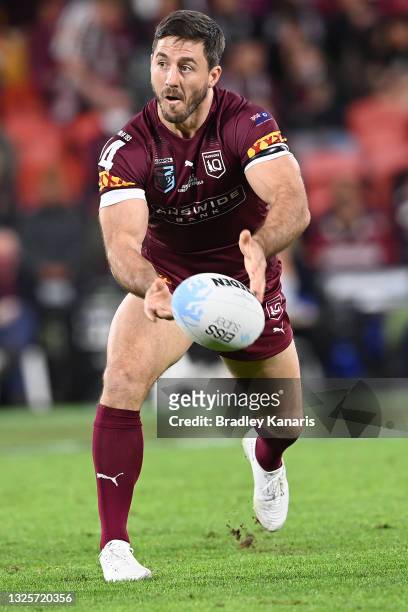 Ben Hunt of the Maroons offloads the ball during game two of the 2021 State of Origin series between the Queensland Maroons and the New South Wales...