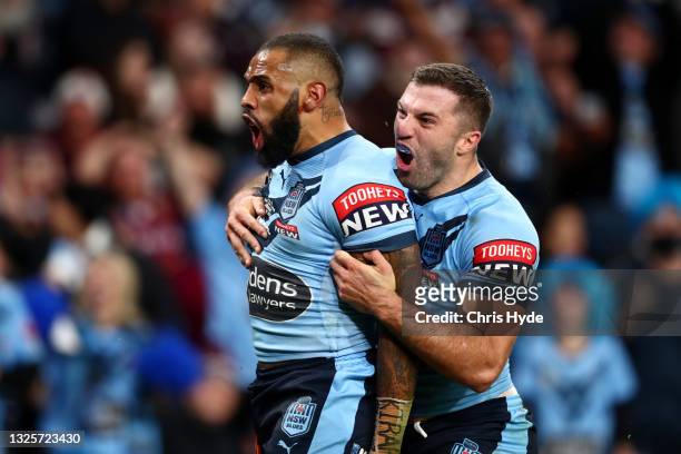 Josh Addo-Carr of the Blues celebrates after scoring a try with James Tedesco of the Blues during game two of the 2021 State of Origin series between...