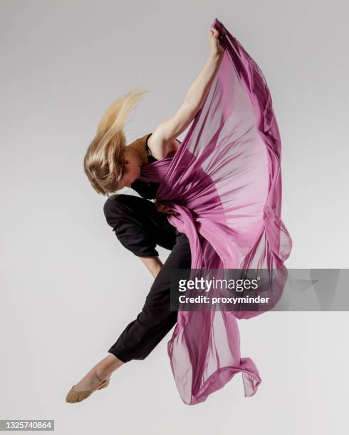dancer on gray background with textile in the air - modern dance bildbanksfoton och bilder