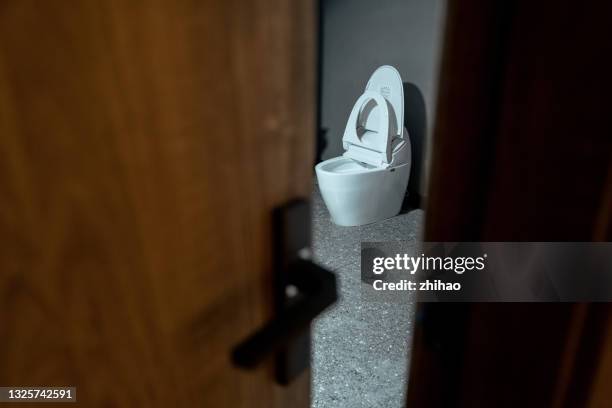 looking at the toilet from the crack of the door - psychopath stock pictures, royalty-free photos & images