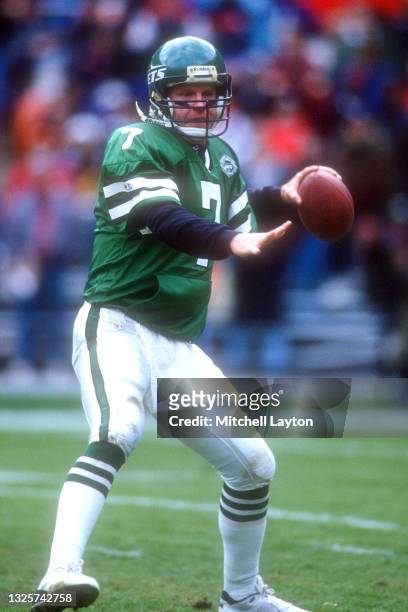 Boomer Esiason of the New York Jets looks to throw a pass during a NFL football game against the Washington Redskins on December 11, 1993 at RFK...