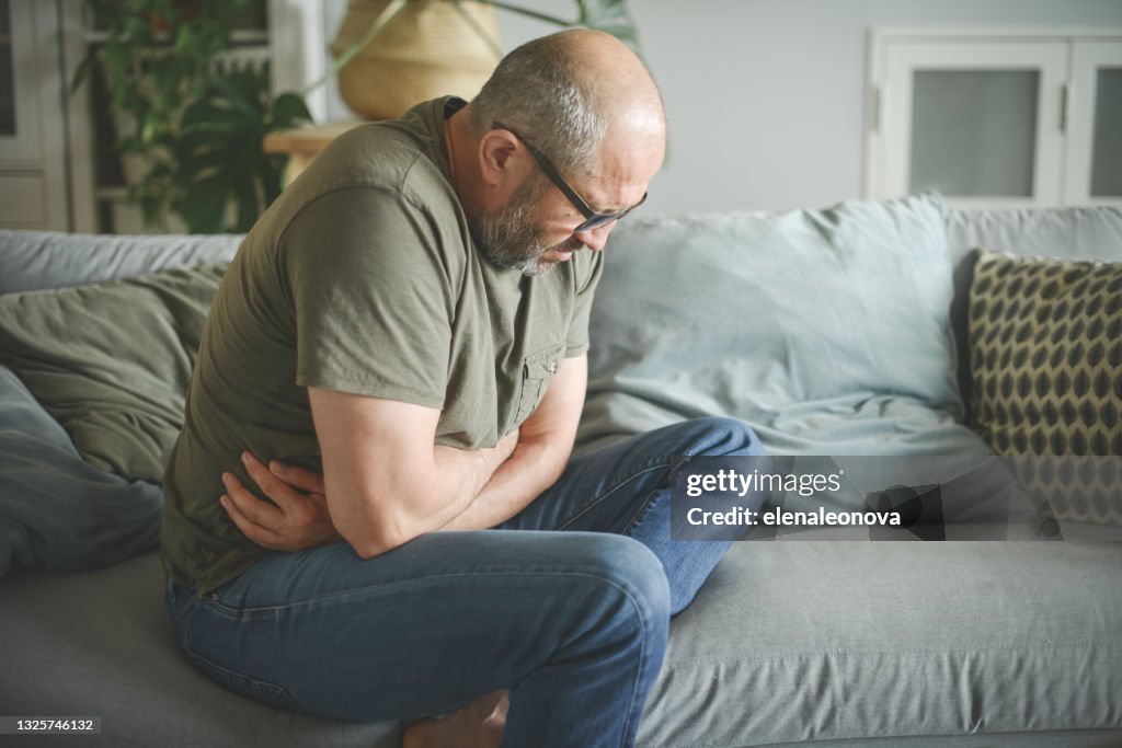 Mature adult man ( illness, stomachache)
