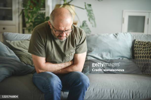 mature adult man ( illness, stomachache) - upset man imagens e fotografias de stock