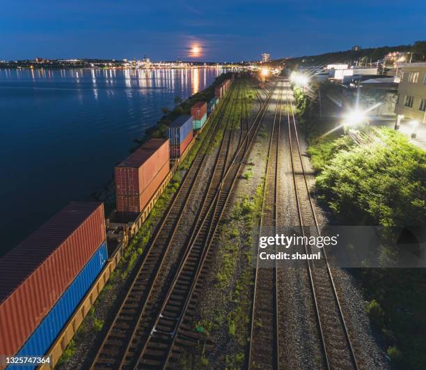 railyard at night - train yard at night stock pictures, royalty-free photos & images