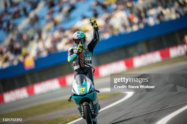 Moto3 rider Dennis Foggia of Italy and Leopard Racing celebrates his win - he stands on his bike and rolls into the pitlane during the Motul TT Assen...