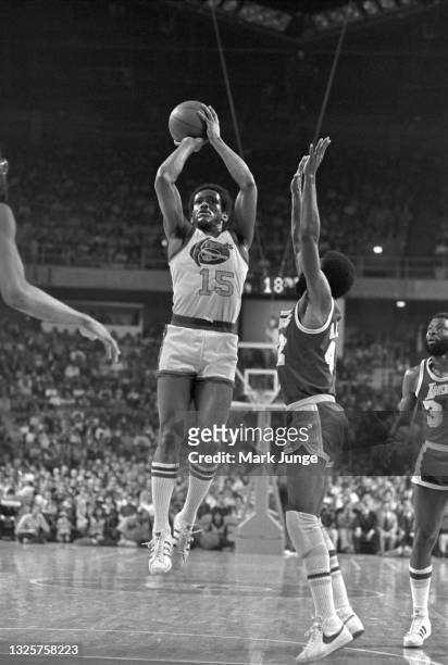 Denver Nuggets guard Jim Price takes a jumper from the free throw line during an NBA basketball game against the Los Angeles Lakers at McNichols...