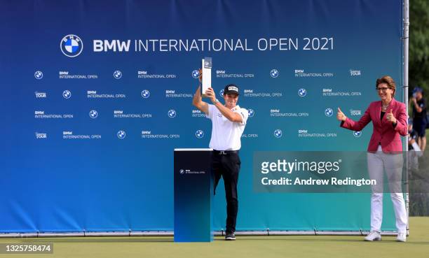 Viktor Hovland of Norway is presented with the winners trophy by Ilka Horstmeier, Member of the Board of Management of BMW AG after the final round...