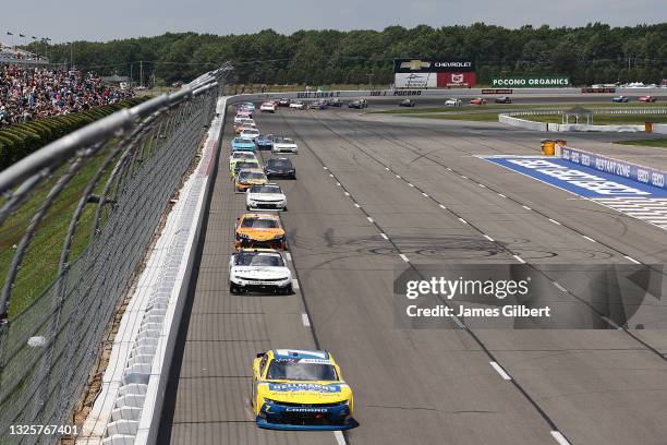 Justin Allgaier, driver of the Hellmann's 100% Recycled Chevrolet, leads the field during the NASCAR Xfinity Series Pocono Green 225 Recycled by J.P....